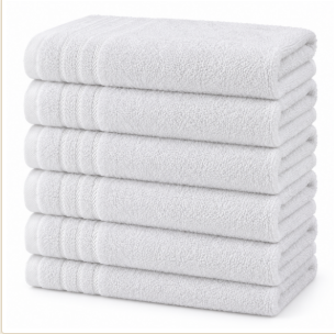A neat stack of white hand towels